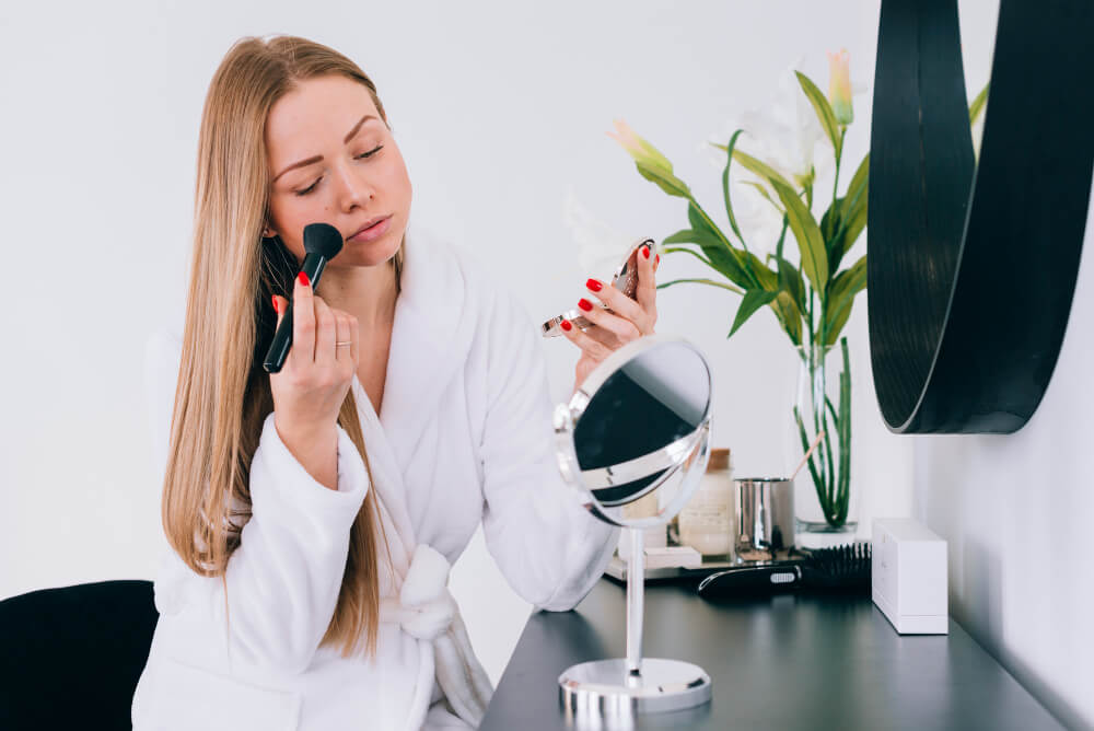 girl-doing-her-make-up-bathroom makeup desk