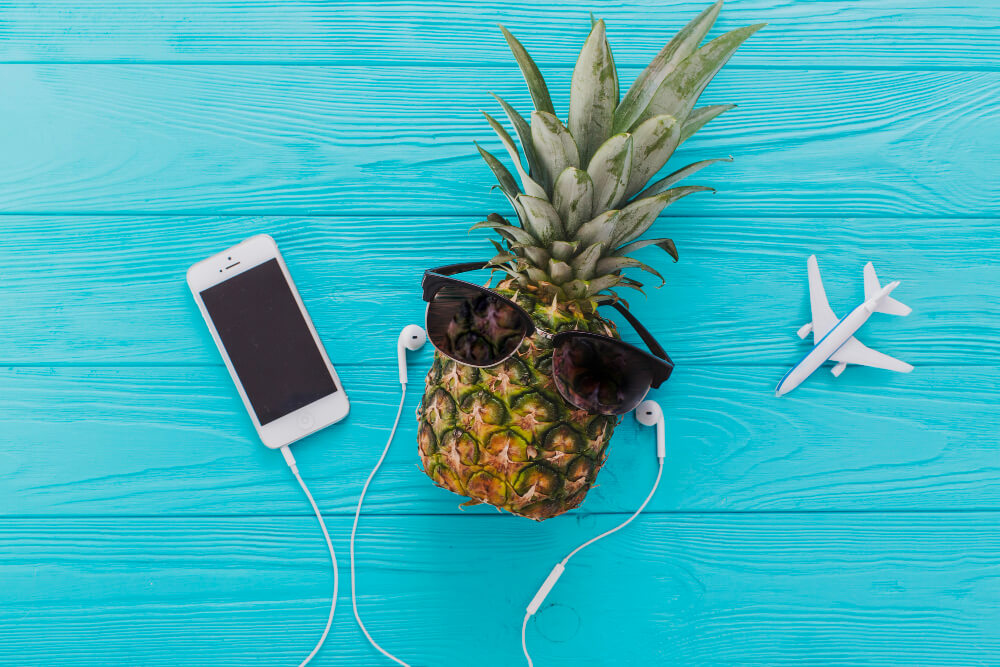 summer-composition-with-pineapple-sunglasses-mobile-phone (1) 10 Summer Self-Care Ideas to Raise the Good Vibes - 1