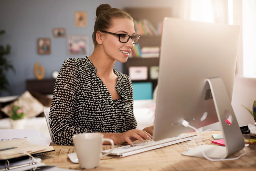 young-woman-front-her-computer (1) Developing an Efficient Home Office: Unlock Your Productivity Potential - 2
