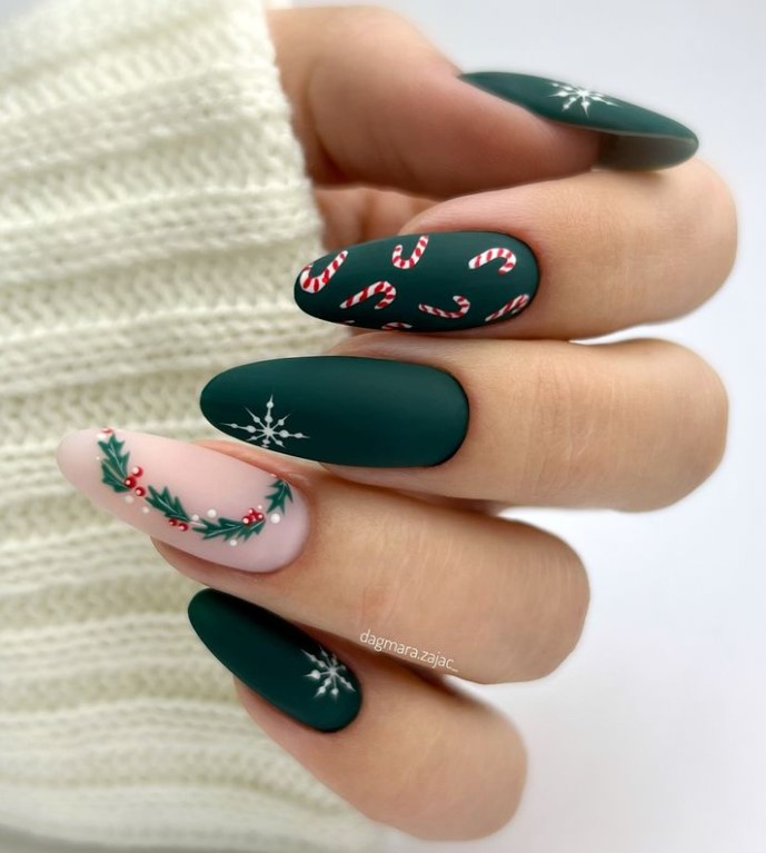 Matte green nails with snowflakes and candy canes Matte green nails with snowflakes and candy canes