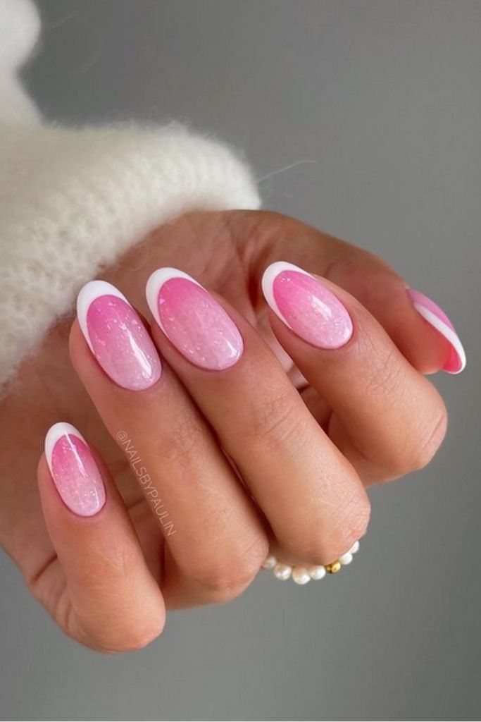 Delicate Pink Almond Nails with a Glittery French Accent Delicate Pink Almond Nails with a Glittery French Accent