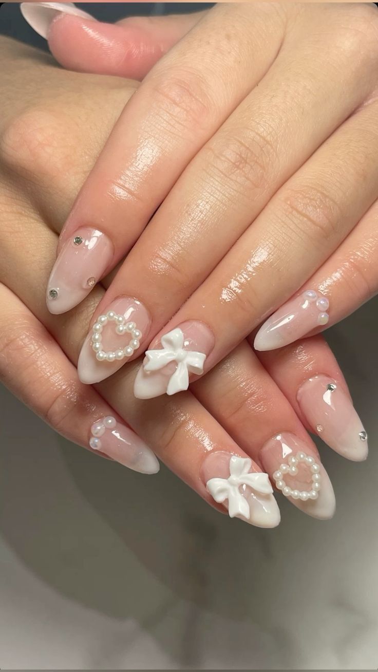 Elegant Pearl and Bow Valentine’s Nails for a Touch of Romance Elegant Pearl and Bow Valentine’s Nails for a Touch of Romance