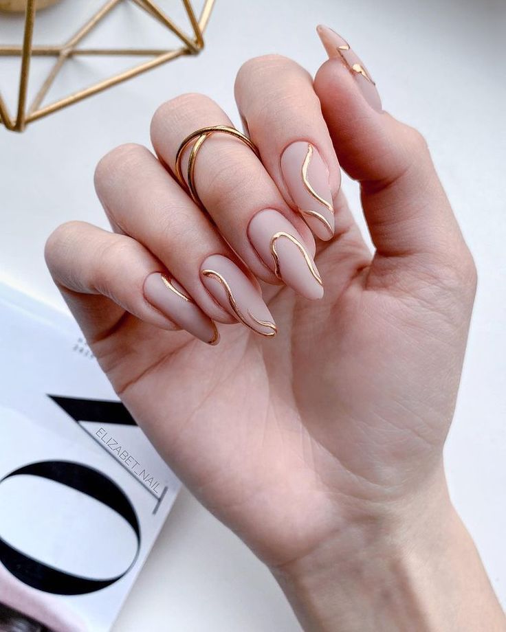almond nails with golden lines almond nails with golden lines