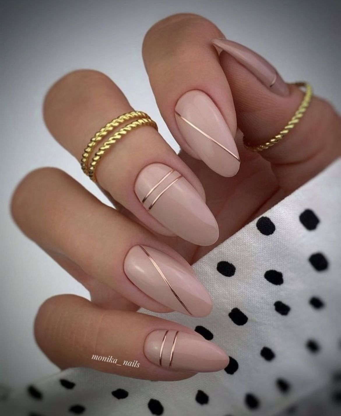 Basic nude nails with golden lines