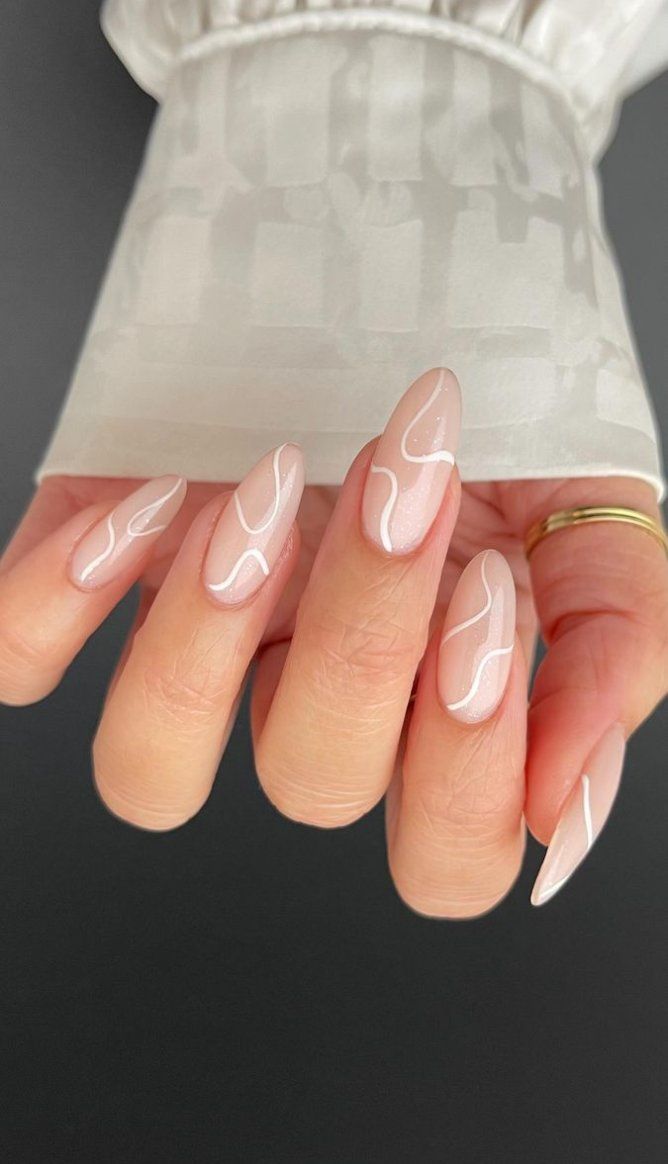 minimalist nude nails with white swirls